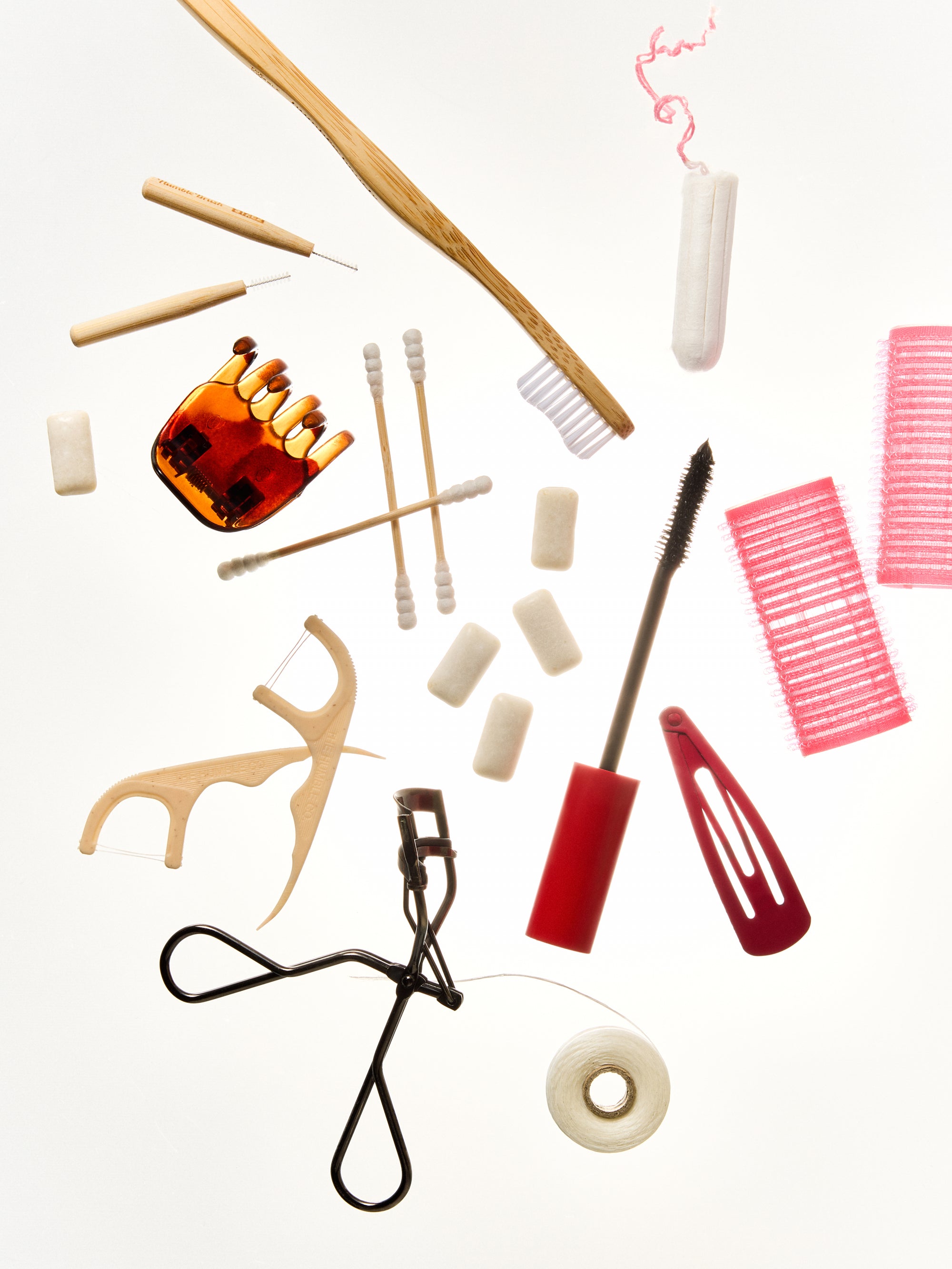 Products spread out, chewing gum,flosspicks, toothbrush