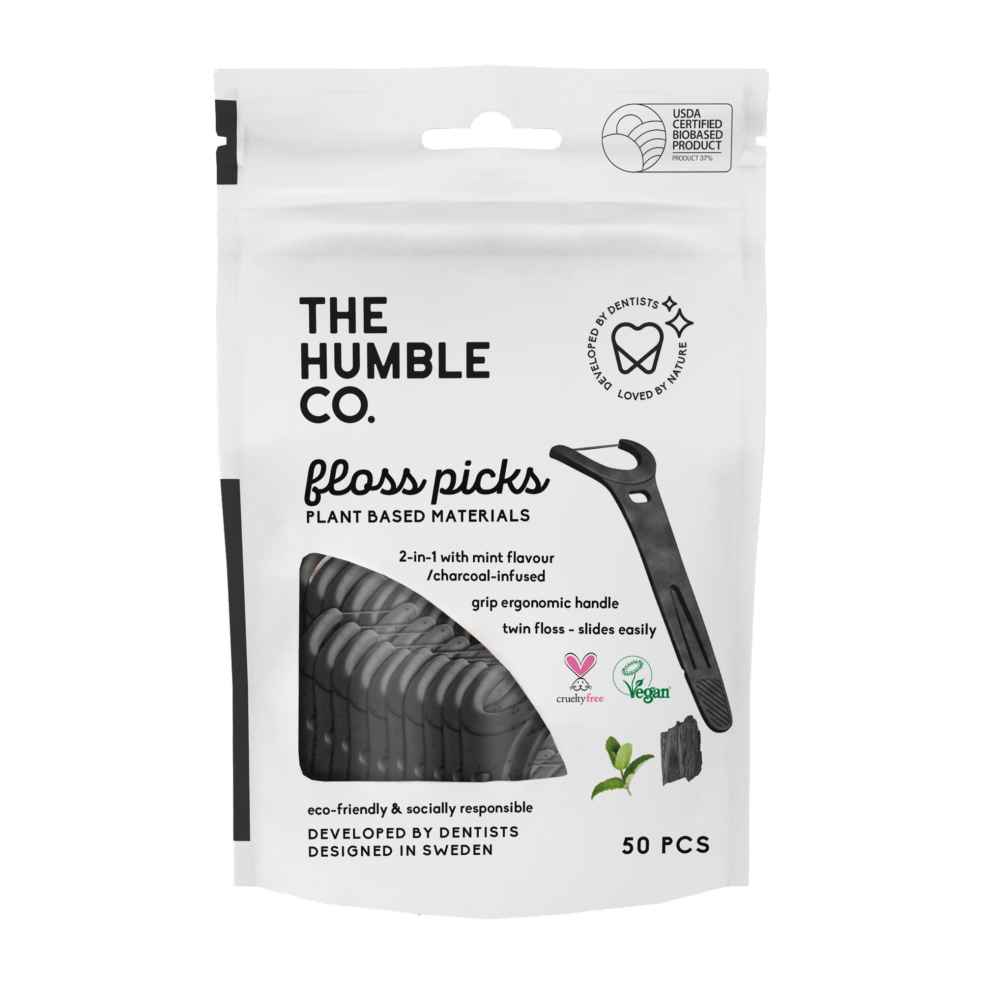 Packaging of 'The Humble Co. Floss Picks' with 50 pieces, featuring a black and white color scheme with green accents, and product information.