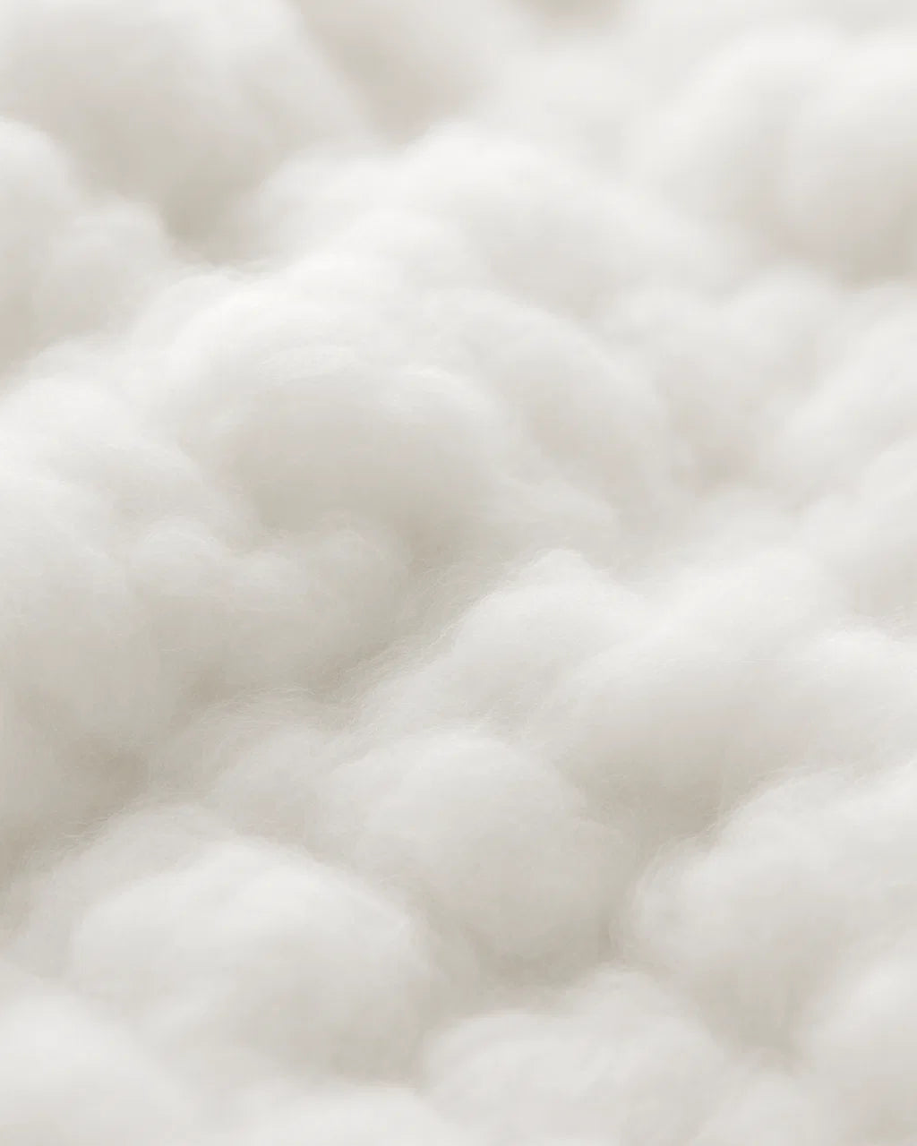 Close-up of a textured white fabric surface