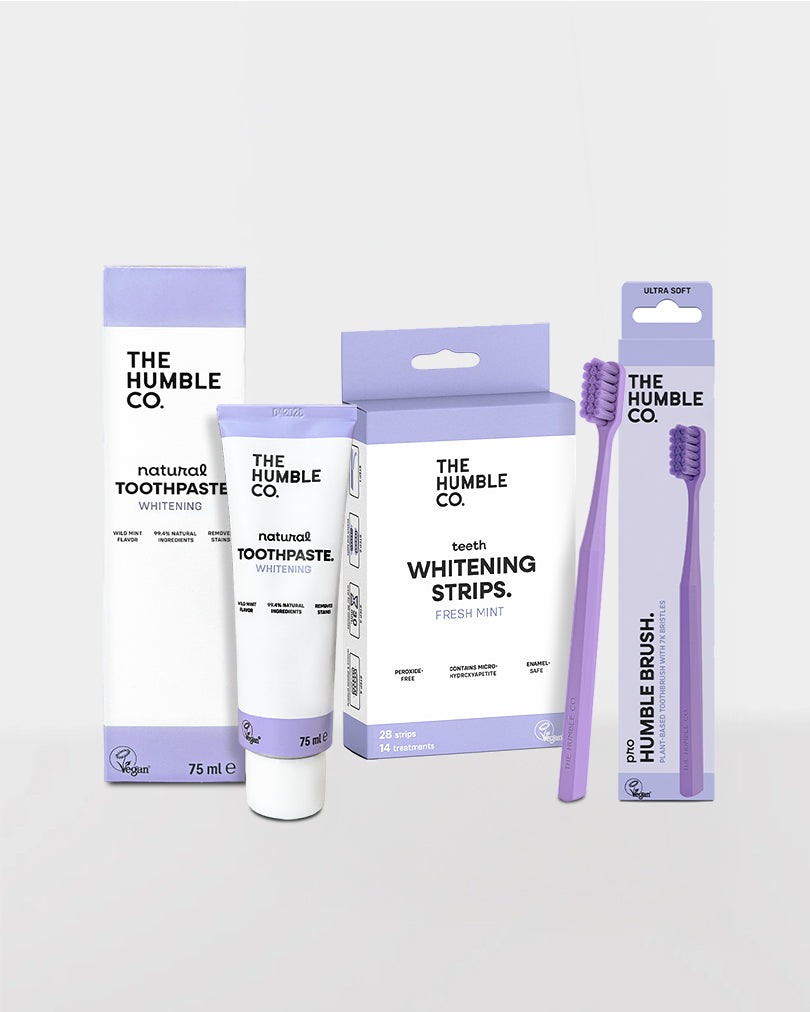 The Humble Co. dental care products including toothpaste, strips, and brush on a light gray background