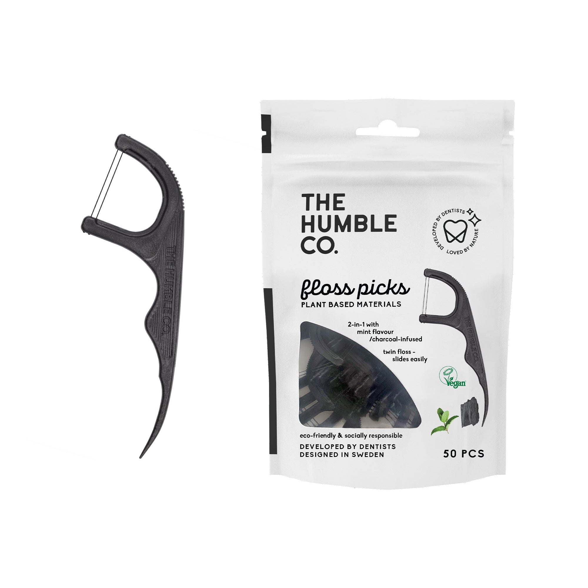 Black floss pick with packaging labeled 'The Humble Co.' on a white background