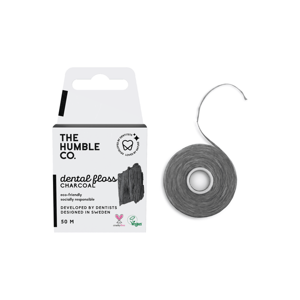 The Humble Co.'s charcoal dental floss, a sustainable option for oral hygiene, with charcoal-infused thread for stain removal and natural wax for gliding.