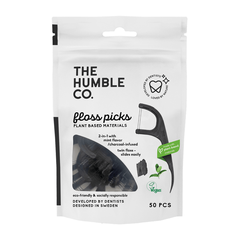 A plastic free bag of plant-based floss picks from The Humble Co., with durable thread, promoting a sustainable and effective approach to oral hygiene.