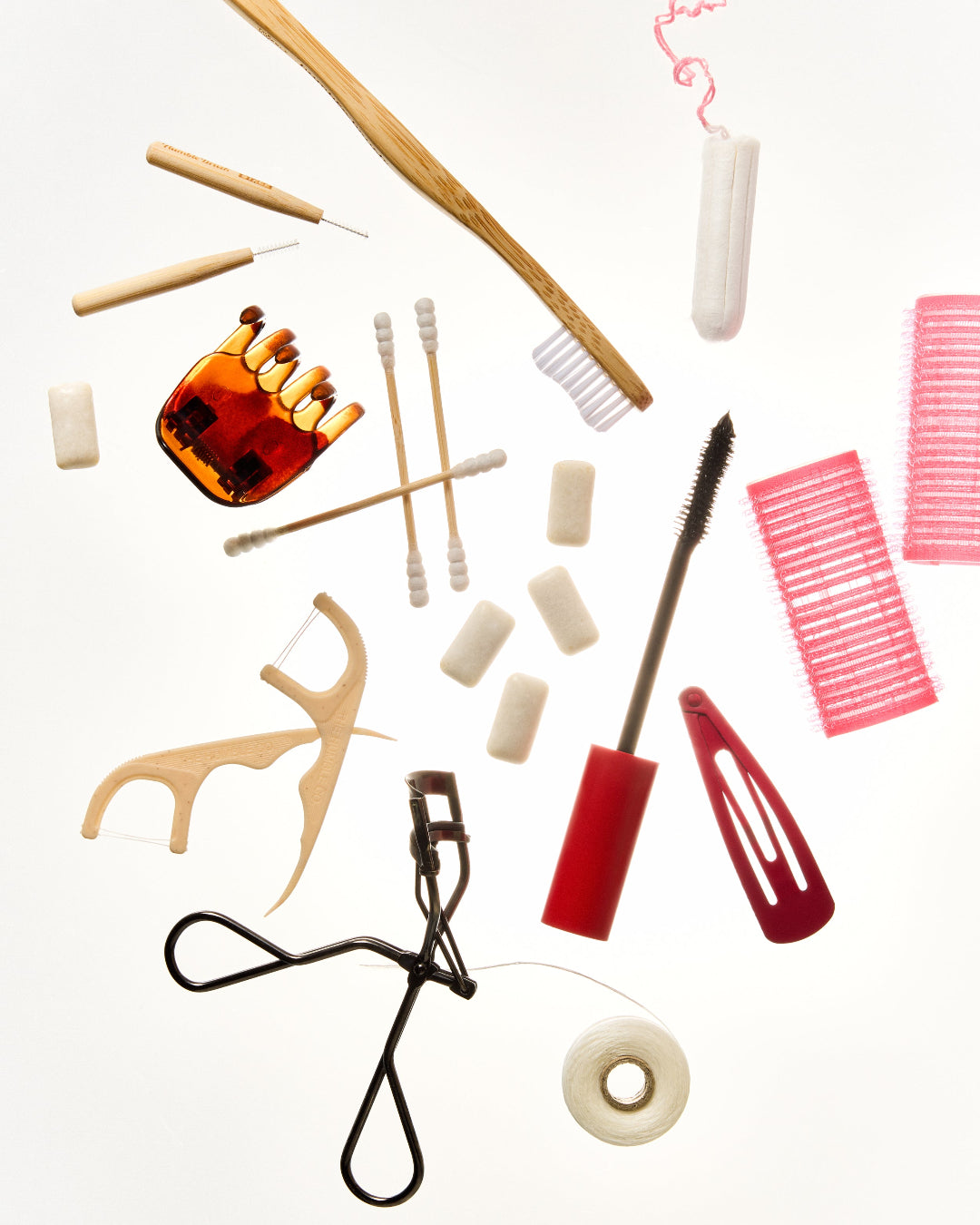 Products spread out, chewing gum,flosspicks, toothbrush