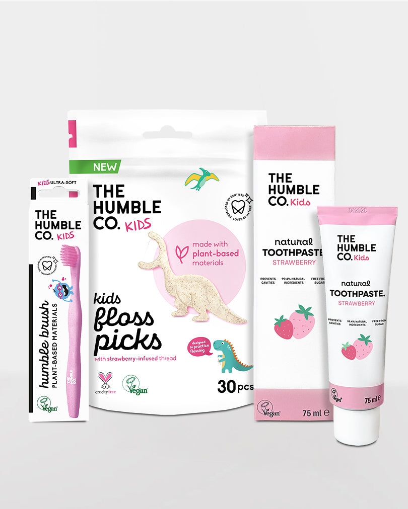 Collection of The Humble Co. kids' dental care products on a white background