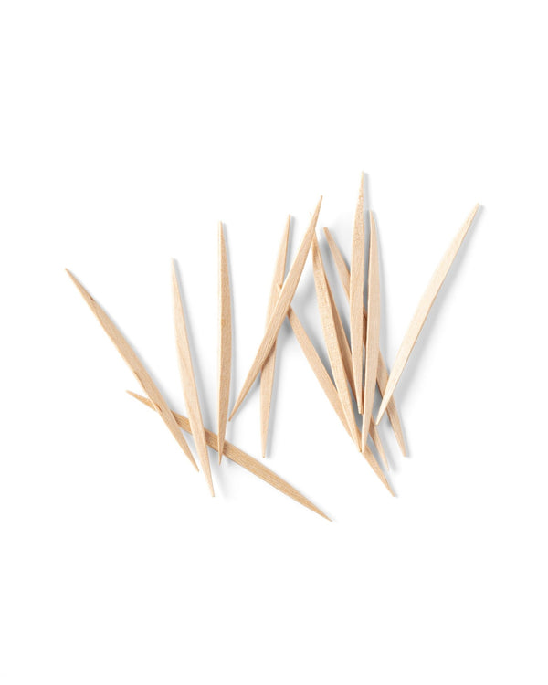 A pile of The Humble Co. bamboo toothpicks, designed with sustainable and eco-friendly materials to promote good oral hygiene.