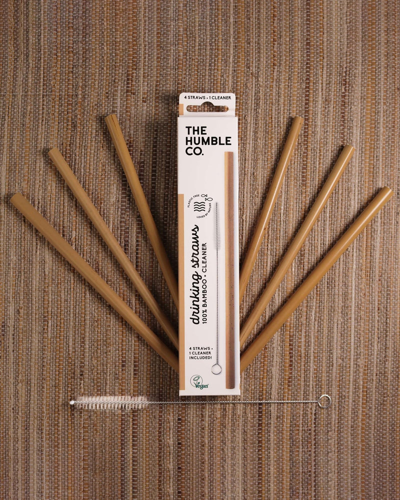 The Humble Co.'s box of reusable bamboo straws, accompanied by a cleaning brush and bamboo straws, promoting a sustainable and eco-friendly alternative to disposable plastic straws.