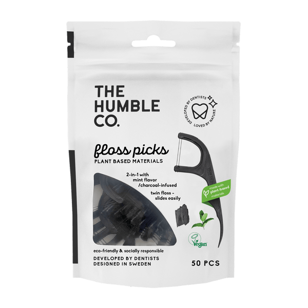 A plastic free bag of plant-based floss picks from The Humble Co., with durable thread, promoting a sustainable and effective approach to oral hygiene.